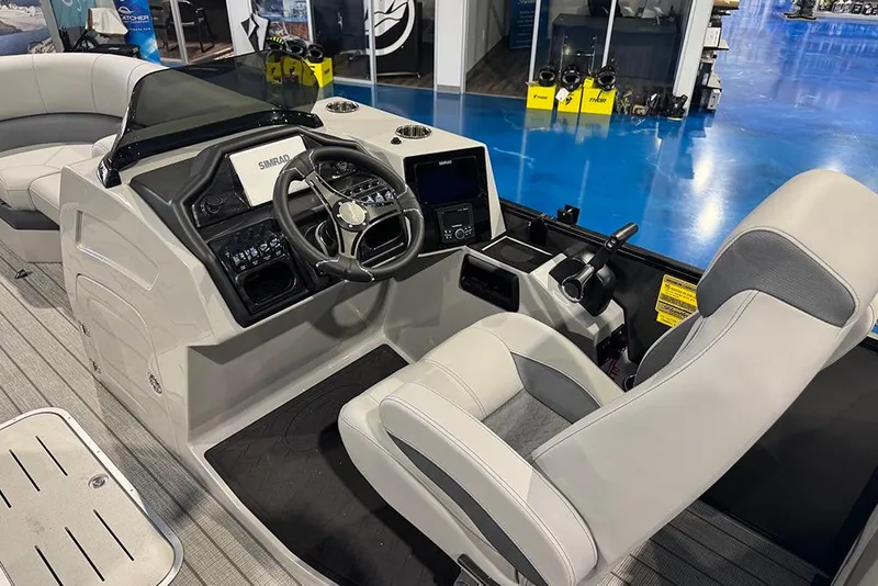 Slide: The Image of 2026 Bentley Pontoons Elite 223 Admiral helm with modern controls and comfortable seating. - 22