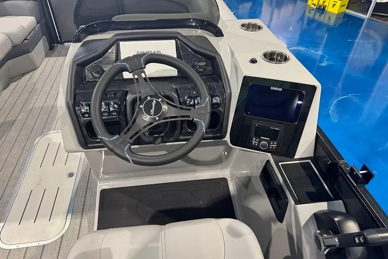 Slide: The Image of 2026 Bentley Pontoons Elite 223 Admiral dashboard with steering wheel and control panel. - 23