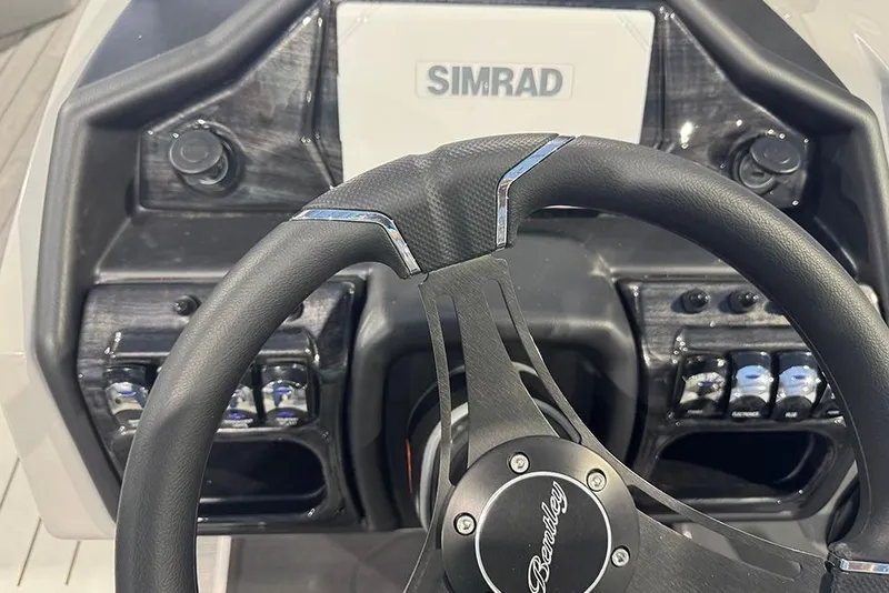 Slide: The Image of 2026 Bentley Pontoons Elite 223 Admiral steering wheel and dashboard with Simrad display. - 24