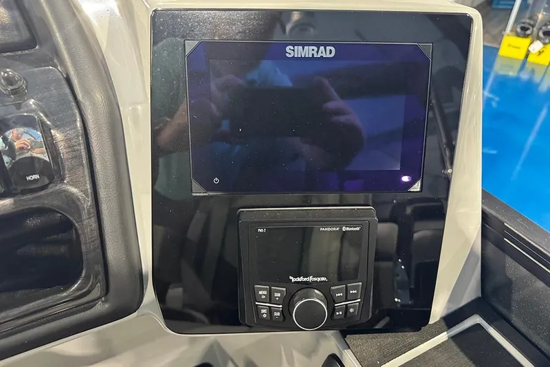 Slide: The Image of 2026 Bentley Pontoons Elite 223 Admiral dashboard with Simrad display and Rockford Fosgate controls. - 25