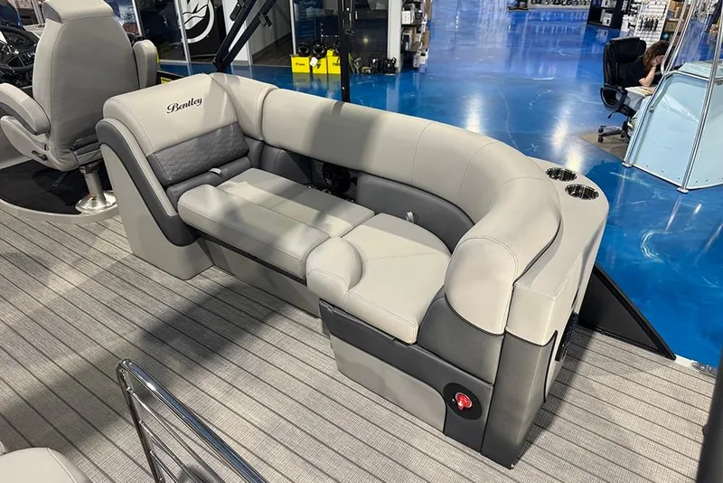 Slide: The Image of 2026 Bentley Pontoons Elite 223 Admiral interior with luxurious gray seating and cup holders. - 28