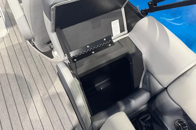 Slide: The Image of 2026 Bentley Pontoons Elite 223 Admiral interior storage compartment with gray seating and flooring. - 30