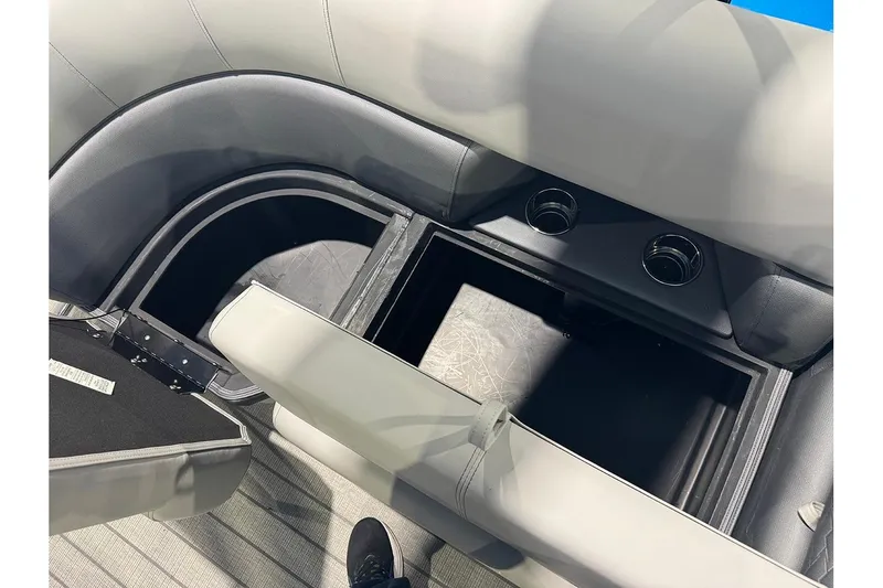 Slide: The Image of 2026 Bentley Pontoons Elite 223 Admiral interior storage compartment with cup holders. - 31
