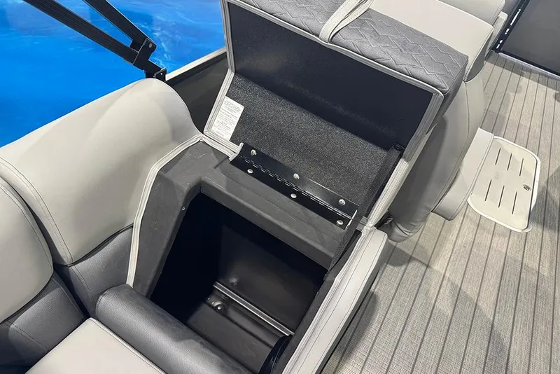 Slide: The Image of 2026 Bentley Pontoons Elite 223 Admiral seat storage compartment, open on a boat deck. - 32