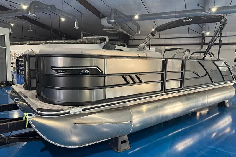 Slide: The Image of 2026 Bentley Pontoons Elite 223 Admiral in showroom, sleek design, modern features. - 4