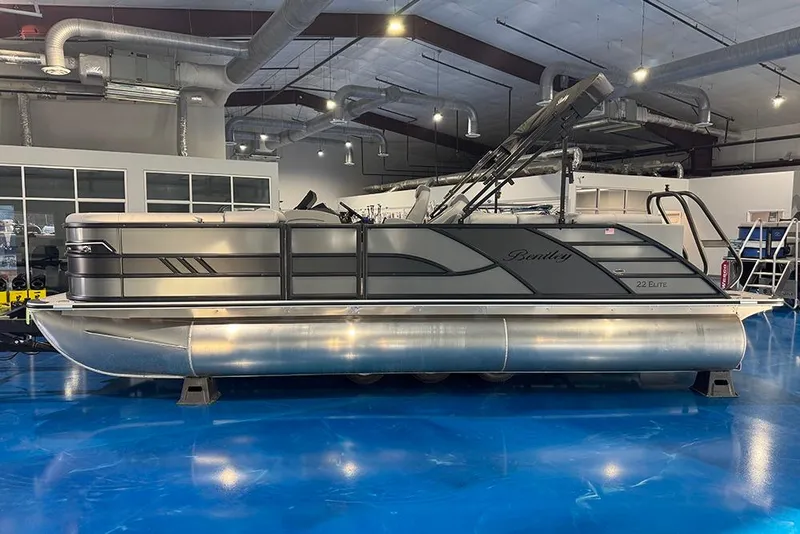 Slide: The Image of 2026 Bentley Pontoons Elite 223 Admiral in showroom, sleek design, modern features. - 5