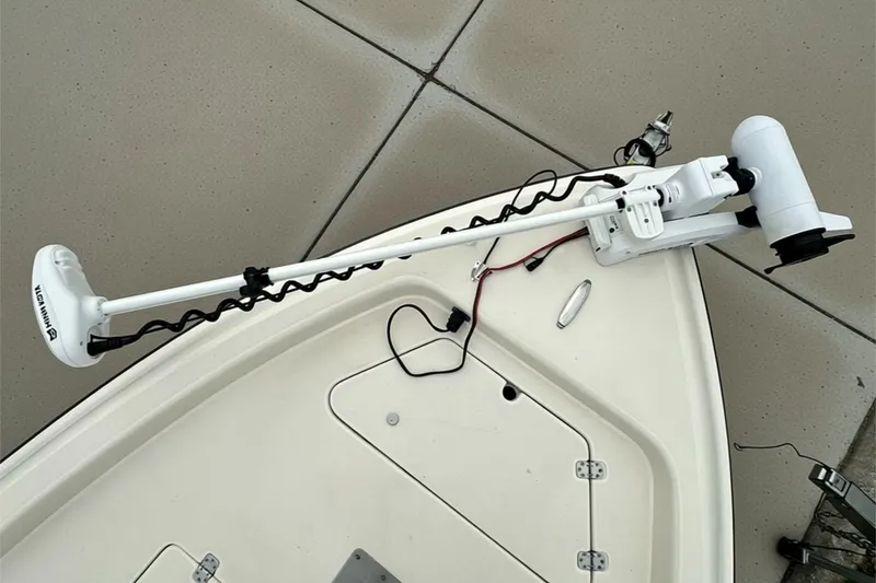 Slide: The Image of Bow of a 2006 ShearWater 2400Z boat with a mounted trolling motor. - 10