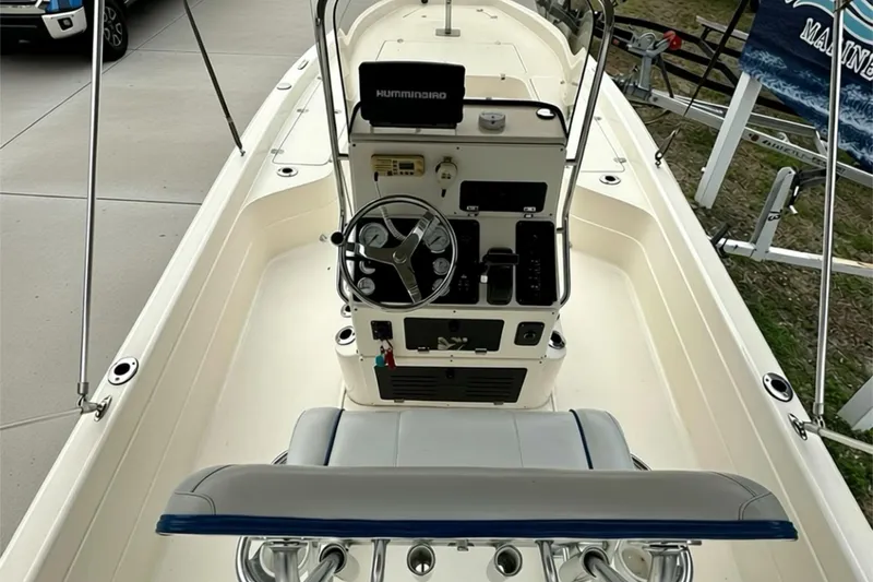 Slide: The Image of 2006 ShearWater 2400Z boat interior with steering console and seating. - 17