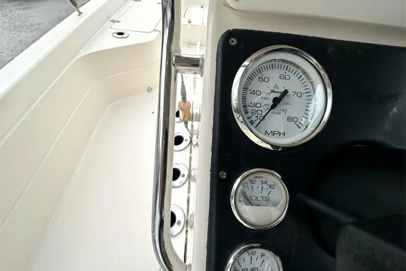 Slide: The Image of Dashboard of a 2006 ShearWater 2400Z boat showing speedometer and voltmeter. - 19