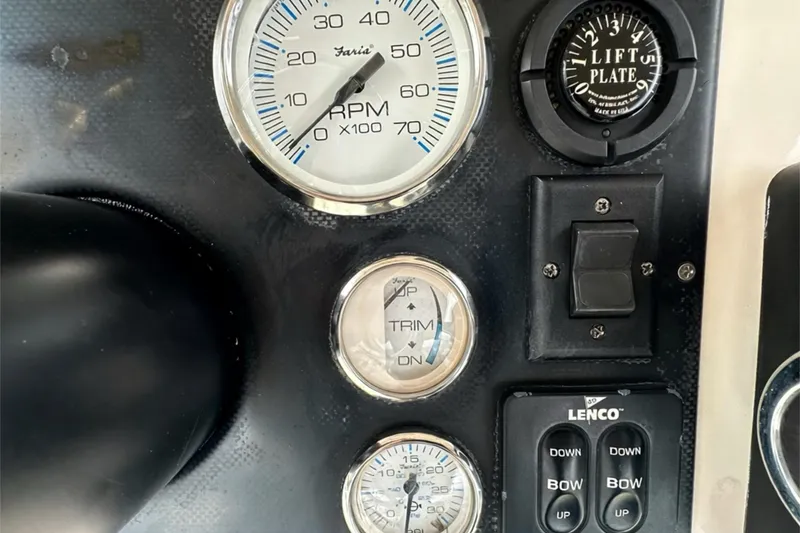 Slide: The Image of Dashboard of a 2006 ShearWater 2400Z boat with RPM and trim gauges. - 20