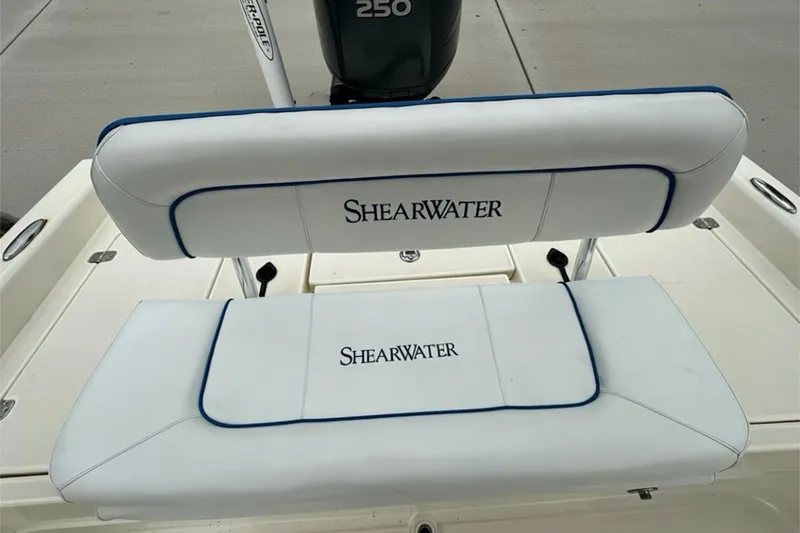 Slide: The Image of White ShearWater 2400Z boat seats, 2006 model, with blue trim detailing. - 23