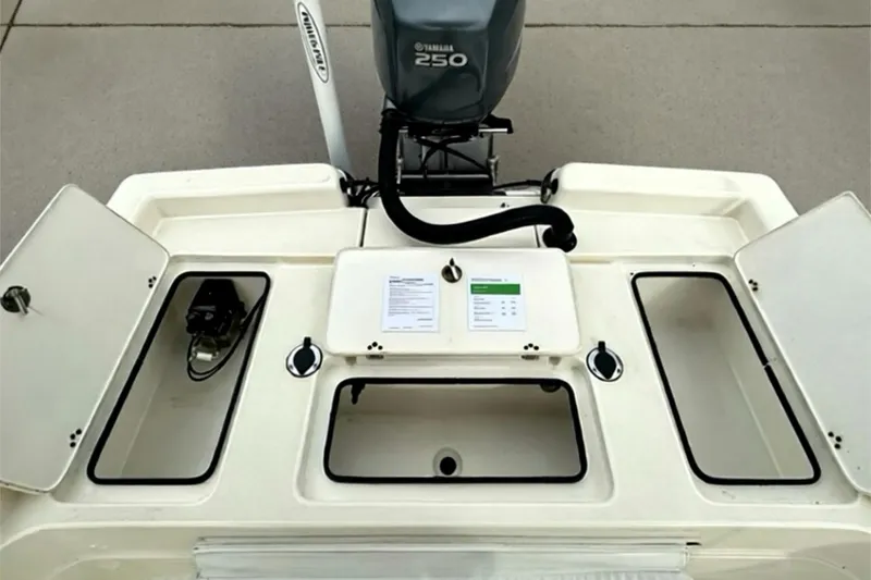 Slide: The Image of 2006 ShearWater 2400Z boat with Yamaha 250 engine, open storage compartments. - 25
