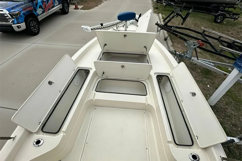 Slide: The Image of 2006 ShearWater 2400Z boat with open storage compartments on a trailer. - 5