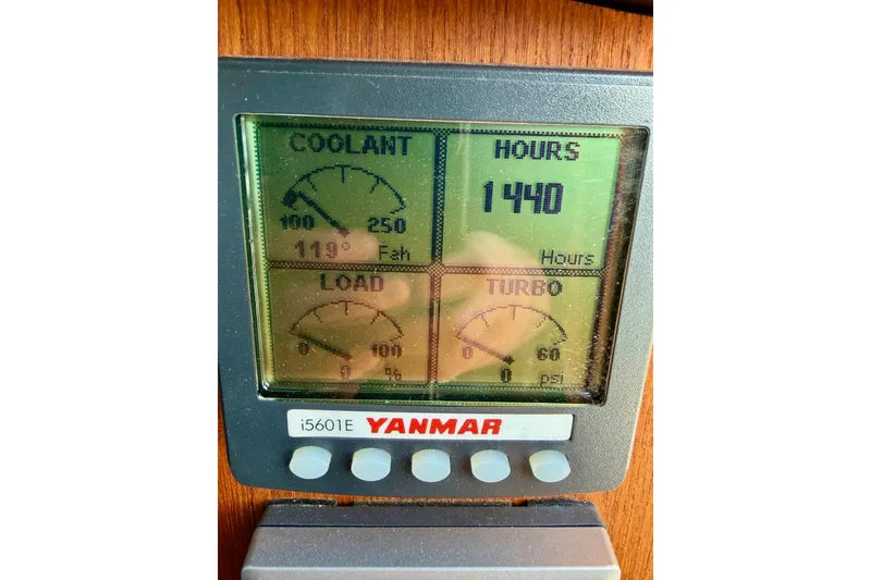 Slide: The Image of Yanmar engine display showing coolant temperature, hours, load, and turbo pressure on a 2012 Ranger Tugs R-29. - 18