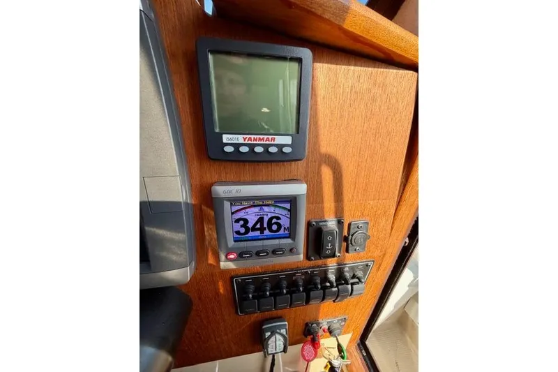 Slide: The Image of Control panel of 2012 Ranger Tugs R-29 boat with Yanmar display and switches. - 19