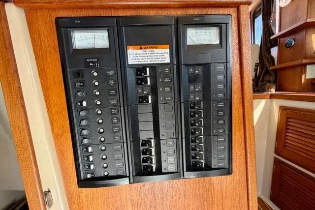 Slide: The Image of Electrical panel of 2012 Ranger Tugs R-29 boat, featuring switches and meters. - 24