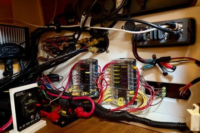 Slide: The Image of Electrical wiring and fuse panel inside a 2012 Ranger Tugs R-29 boat. - 27