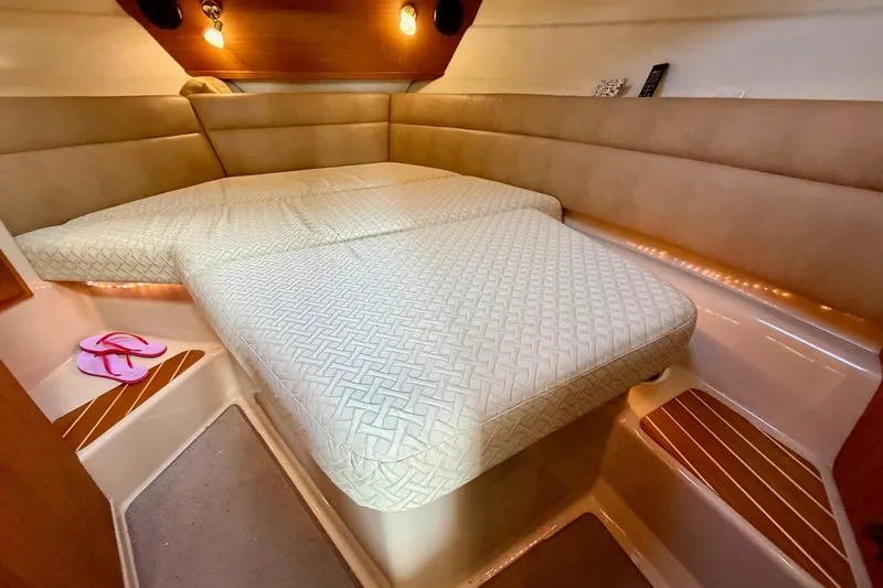 Slide: The Image of Cozy cabin interior of 2012 Ranger Tugs R-29 with comfortable bedding and ambient lighting. - 31