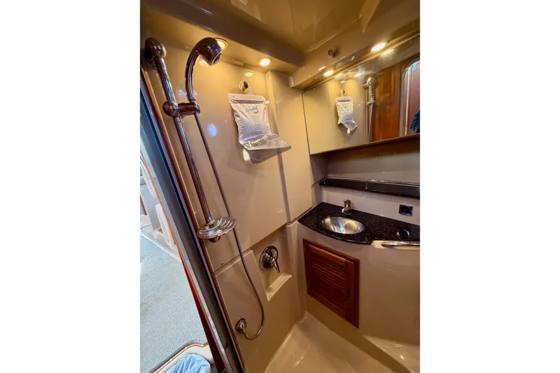 Slide: The Image of 2012 Ranger Tugs R-29 bathroom with shower, sink, and mirror in compact design. - 36