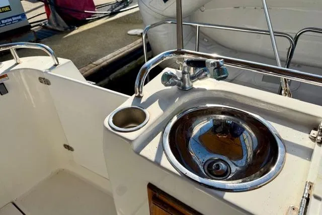 Slide: The Image of 2012 Ranger Tugs R-29 boat sink and cup holder on deck. - 39