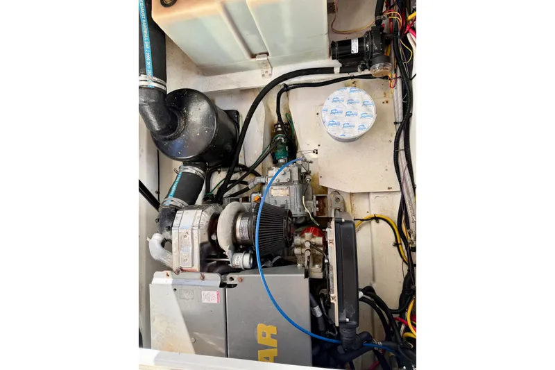 Slide: The Image of Engine compartment of 2012 Ranger Tugs R-29 with visible components and wiring. - 40