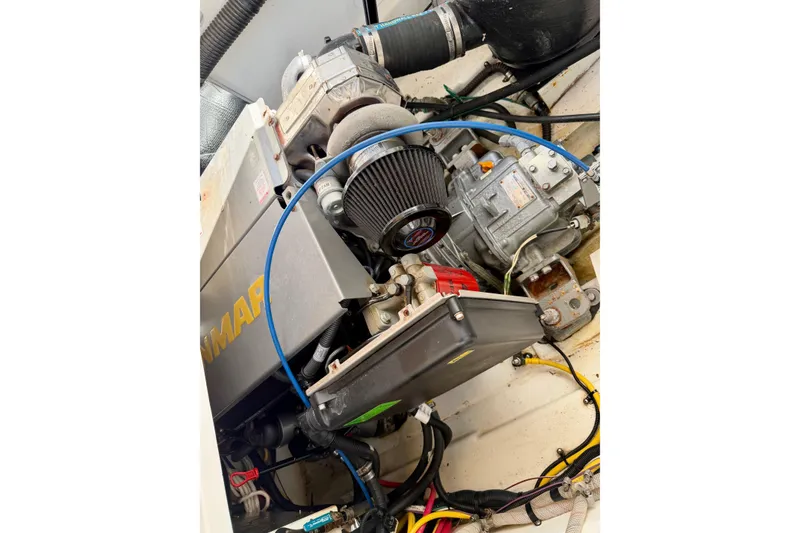 Slide: The Image of Engine compartment of a 2012 Ranger Tugs R-29 boat, showcasing mechanical components. - 41