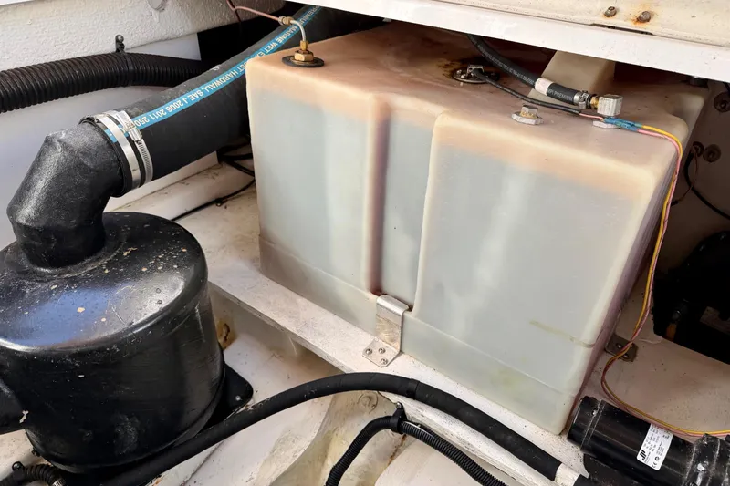 Slide: The Image of Engine compartment of 2012 Ranger Tugs R-29 with fuel tank and hoses. - 42