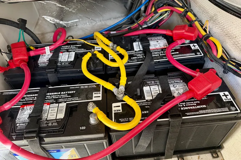 Slide: The Image of Battery compartment of a 2012 Ranger Tugs R-29 with connected cables. - 46