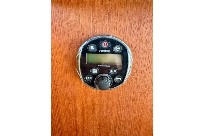 Slide: The Image of Fusion MS-WR600 stereo control on 2012 Ranger Tugs R-29 boat's wooden panel. - 49