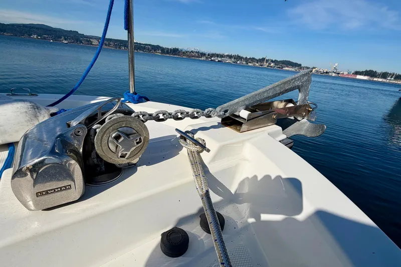 Slide: The Image of Anchor and winch on 2012 Ranger Tugs R-29 boat, docked in calm waters. - 51
