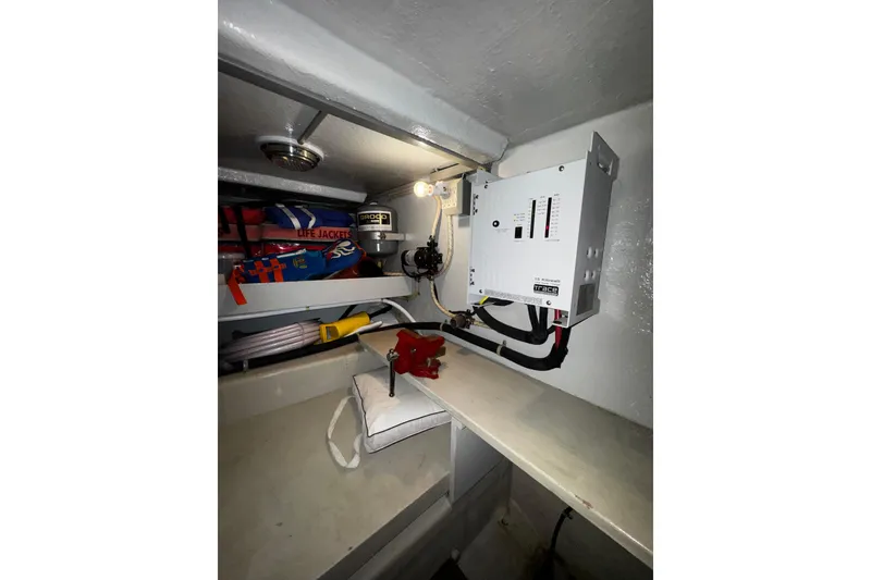 Slide: The Image of Electrical panel and storage area in 1998 Mikelson 43 Sportfisher boat. - 21