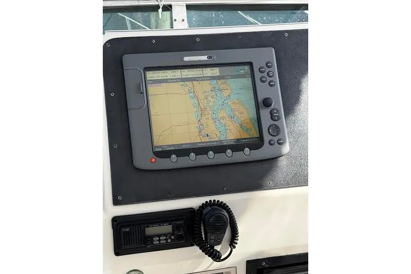 Slide: The Image of Navigation system on 1998 Mikelson 43 Sportfisher boat dashboard. - 30
