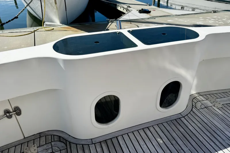 Slide: The Image of Cockpit view of 1998 Mikelson 43 Sportfisher with teak deck and storage compartments. - 4