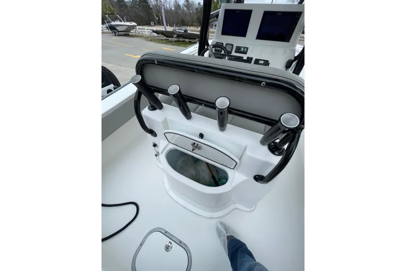 Slide: The Image of 2023 Cape Horn 24 XS boat console with rod holders and navigation screens. - 13