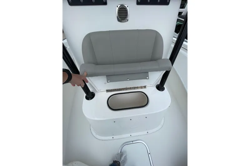 Slide: The Image of 2023 Cape Horn 24 XS boat interior with seating and storage compartment. - 15