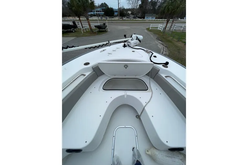 Slide: The Image of 2023 Cape Horn 24 XS boat deck with seating and storage compartments. - 17