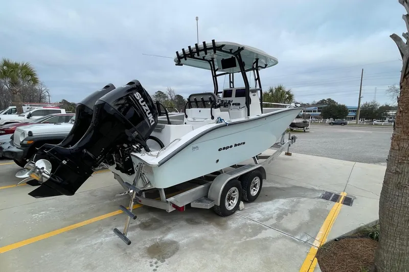 Slide: The Image of 2023 Cape Horn 24 XS boat on trailer with Suzuki outboard motor. - 3