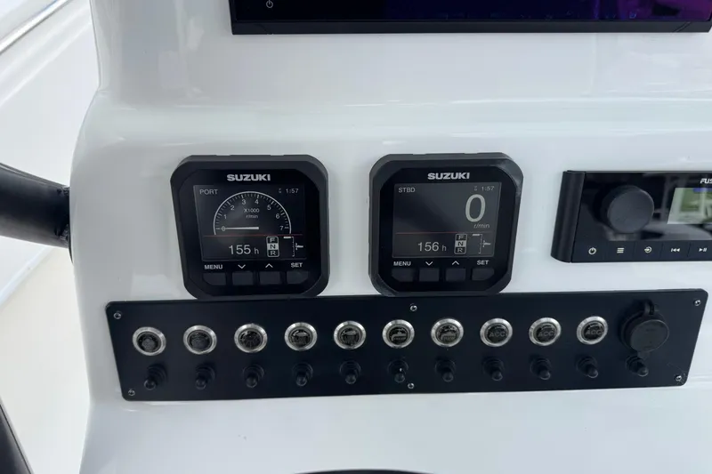 Slide: The Image of Dashboard of 2023 Cape Horn 24 XS boat with Suzuki gauges and controls. - 7
