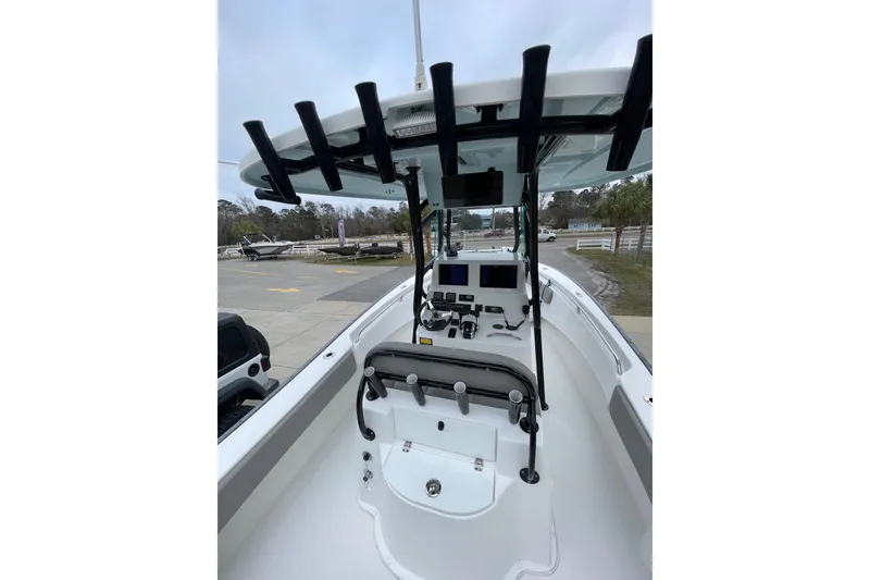 Slide: The Image of 2023 Cape Horn 24 XS boat interior with modern dashboard and rod holders. - 8