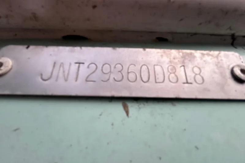 Slide: The Image of 2018 NauticStar 28 XS boat identification plate with serial number JNT29360D818. - 103