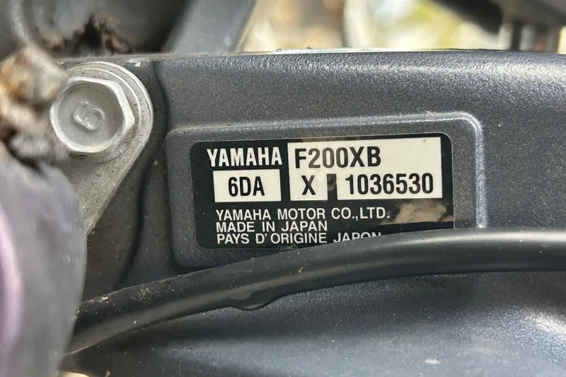 Slide: The Image of Yamaha F200XB engine label on 2018 NauticStar 28 XS, made in Japan. - 104