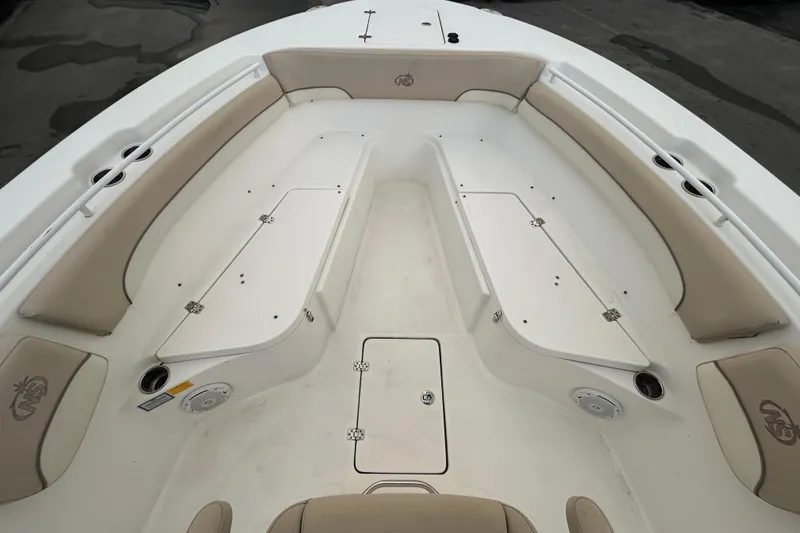 Slide: The Image of 2018 NauticStar 28 XS boat interior with rod holders and seating. - 14