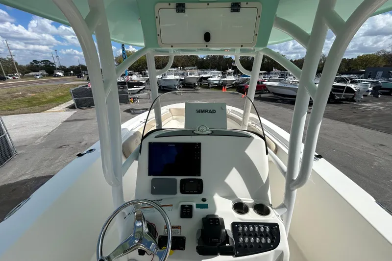Slide: The Image of 2018 NauticStar 28 XS boat dashboard with steering wheel and navigation equipment. - 20