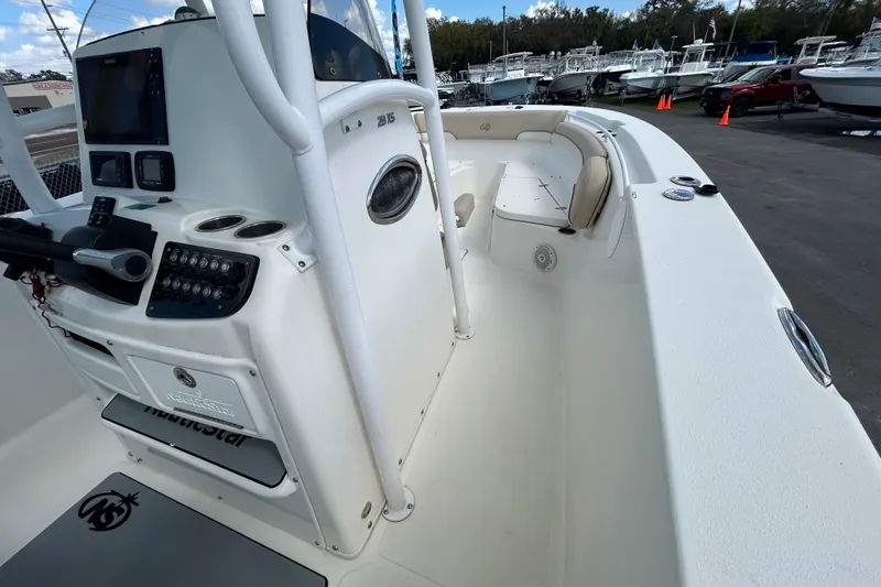 Slide: The Image of 2018 NauticStar 28 XS boat interior with control panel and seating area. - 23