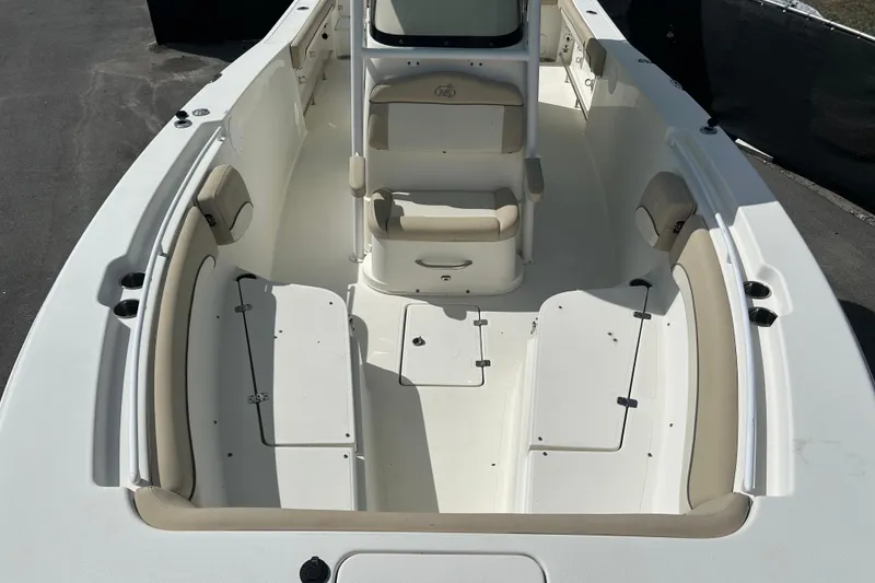 Slide: The Image of 2018 NauticStar 28 XS boat interior with seating and storage compartments. - 28