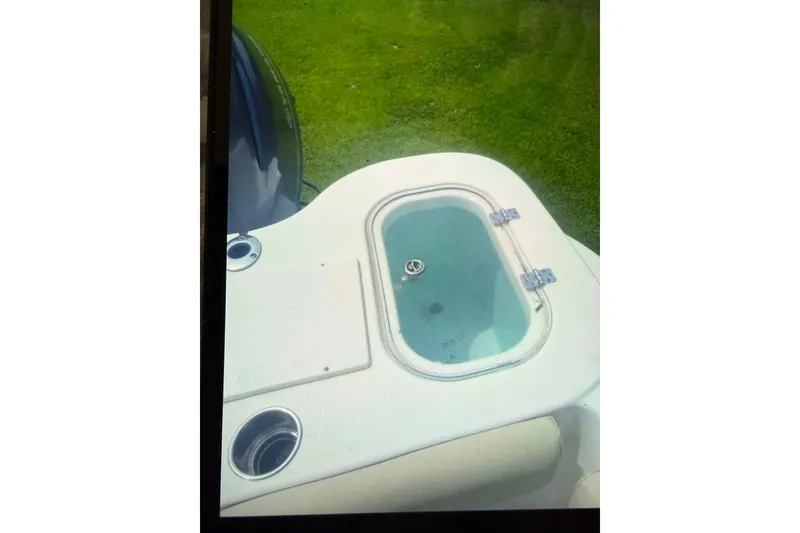 Slide: The Image of 2018 NauticStar 28 XS boat on trailer with Yamaha outboard motor. - 3