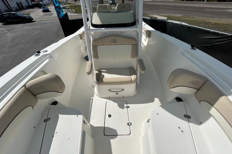 Slide: The Image of 2018 NauticStar 28 XS boat interior with beige seating and spacious deck layout. - 33
