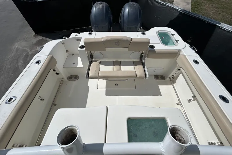 Slide: The Image of 2018 NauticStar 28 XS boat interior with seating and dual engines. - 36