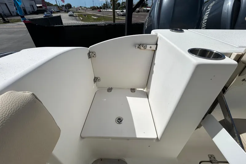 Slide: The Image of 2018 NauticStar 28 XS boat interior with seating and cup holder. - 38