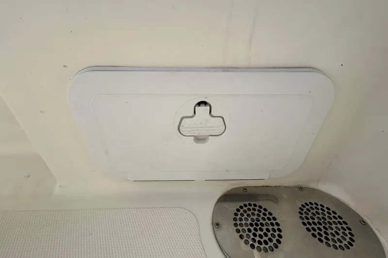 Slide: The Image of Hatch and speaker on 2018 NauticStar 28 XS boat interior. - 49